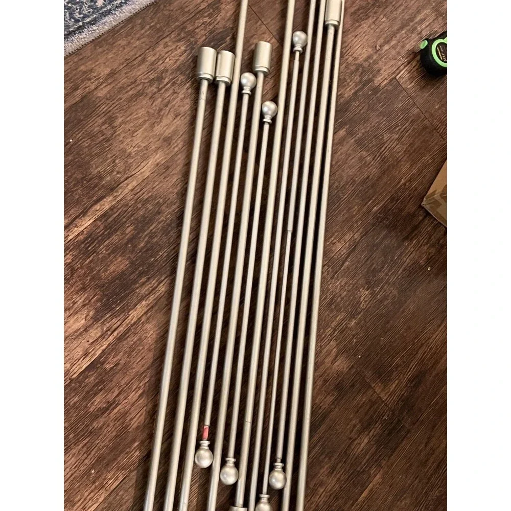 Lot of 11 brushed steel extendable curtain poles various sizes (see description)